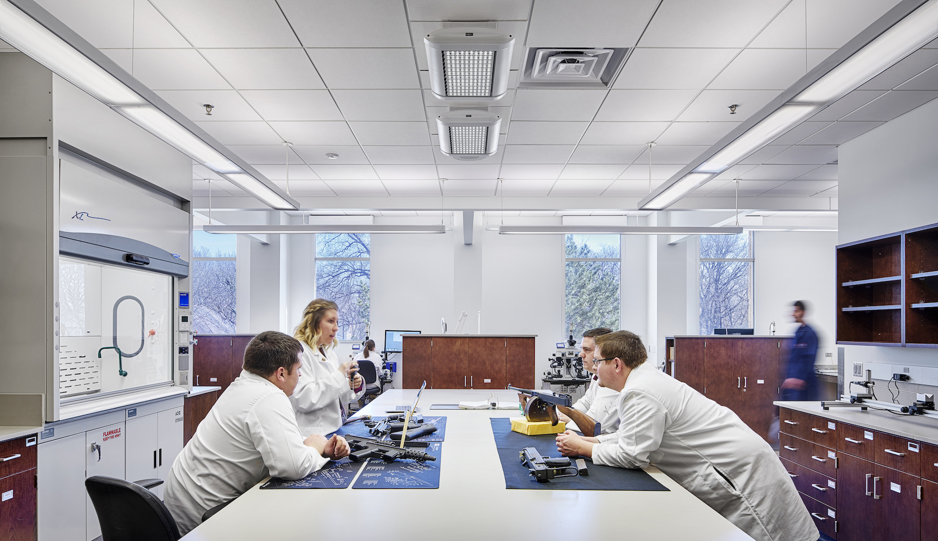 Associates discussing firearms at the Kansas Bureau of Investigation Forensic Science Center