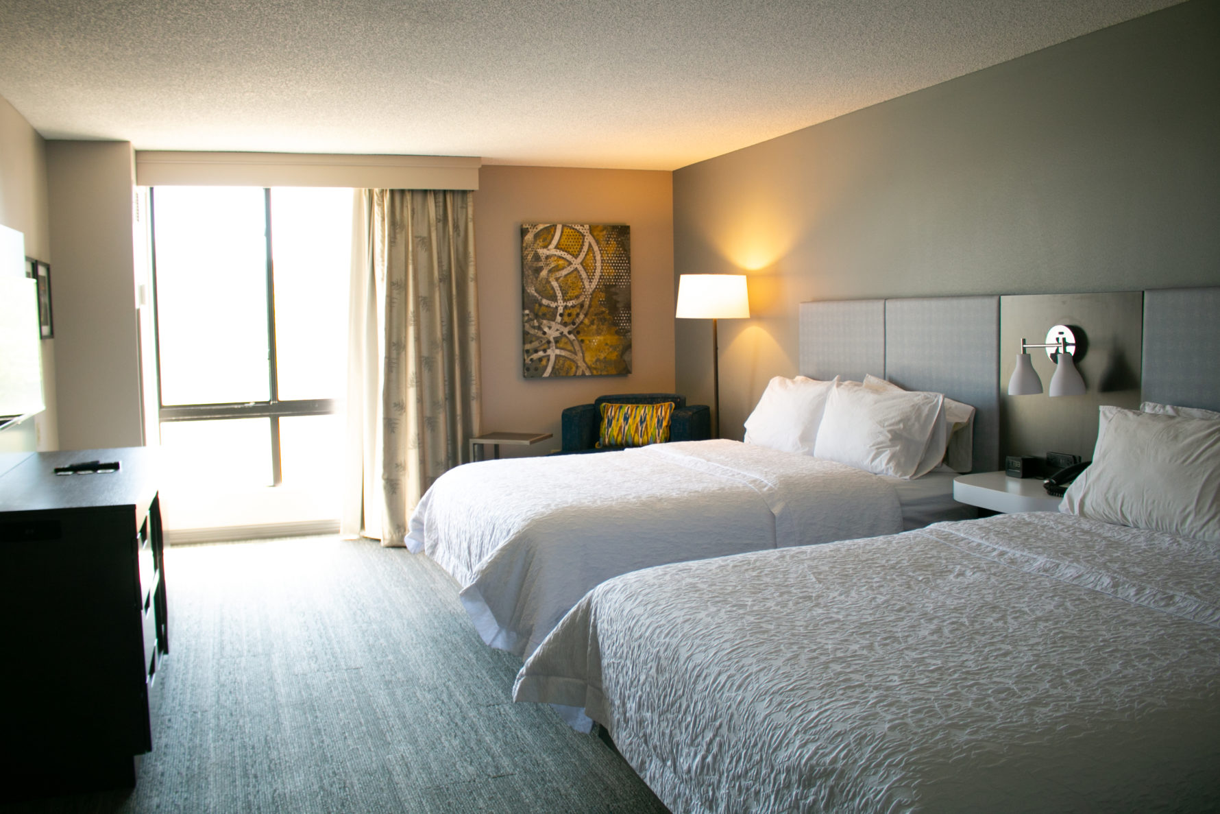 A room with two beds inside of Hampton Inn KC