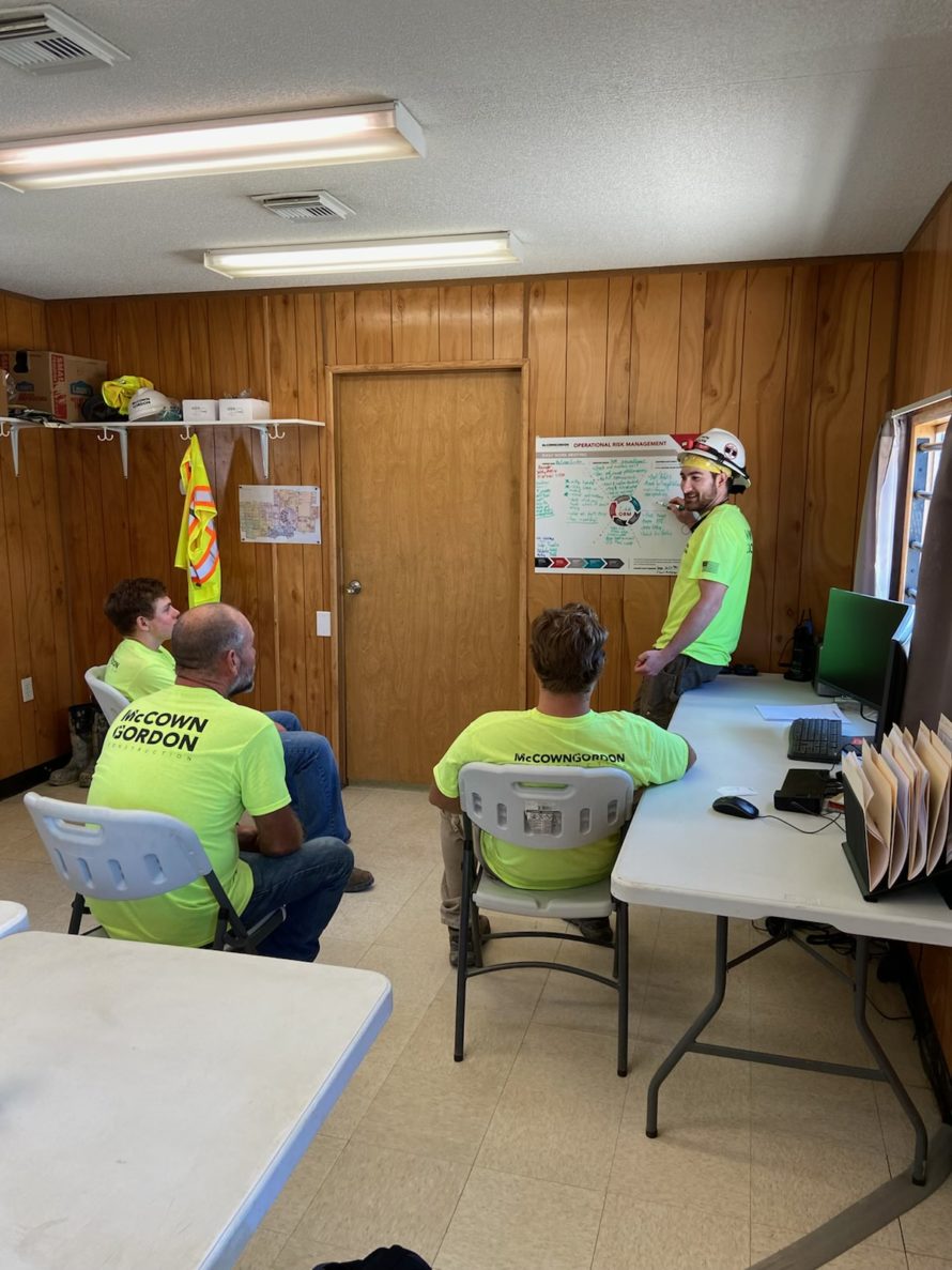 A McCownGordon Construction project team filling out an operational risk management board on a job site