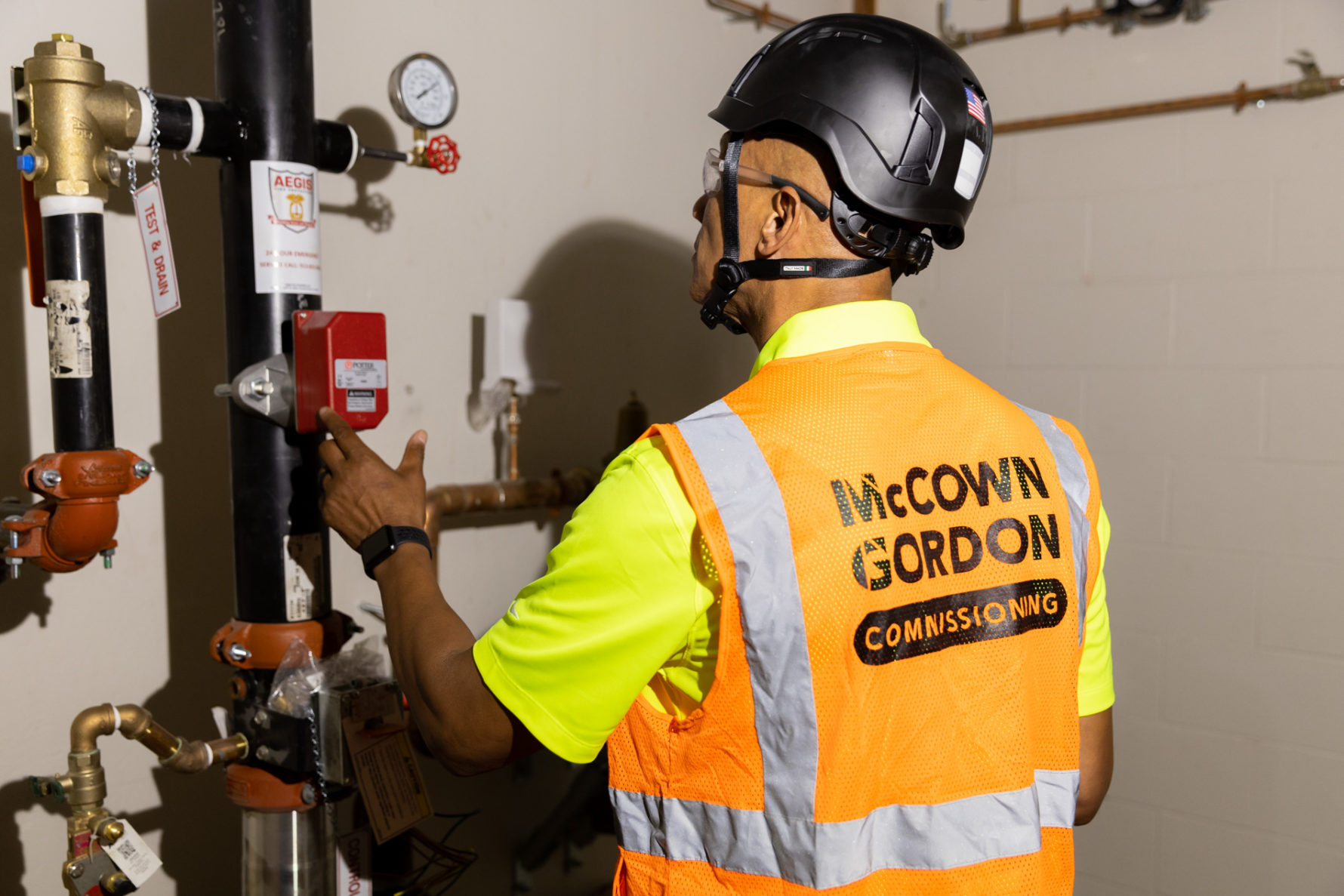 A McCownGordon Construction associate from the commissioning team examining systems on a project site