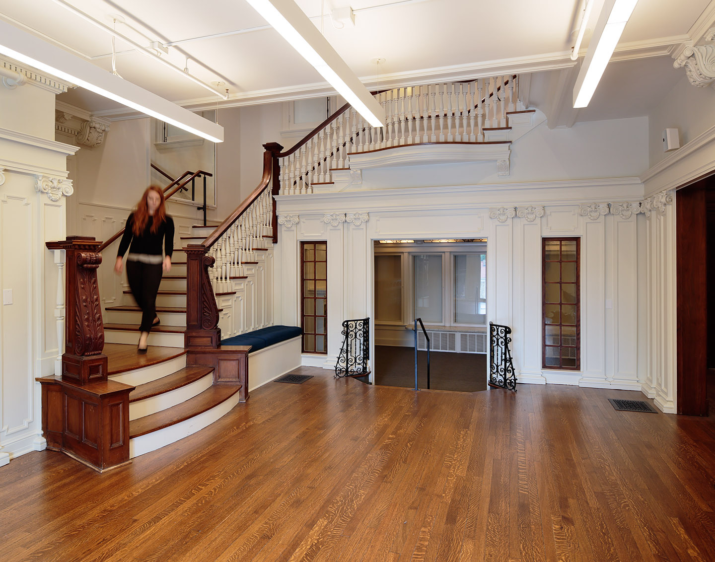 A woman walking down the stairs at the National Museum of Toys and Miniatures