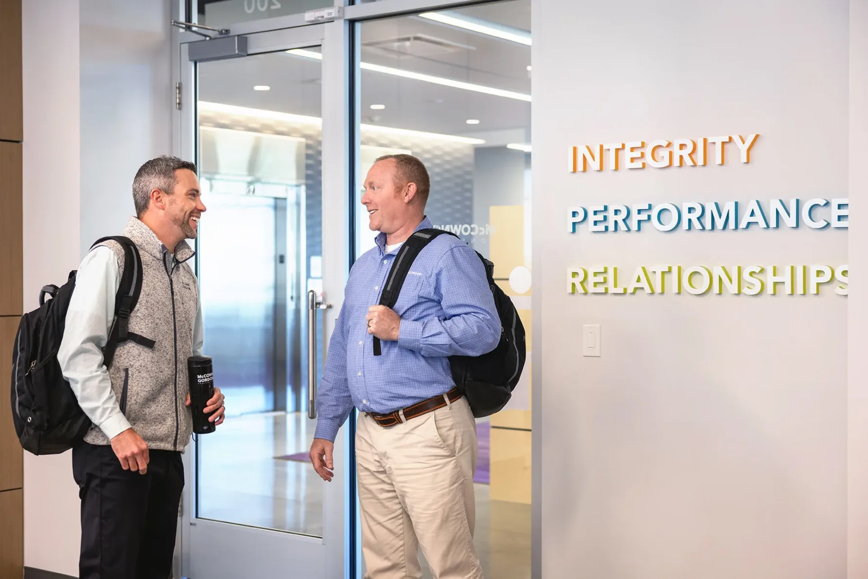 Two men talking in the office