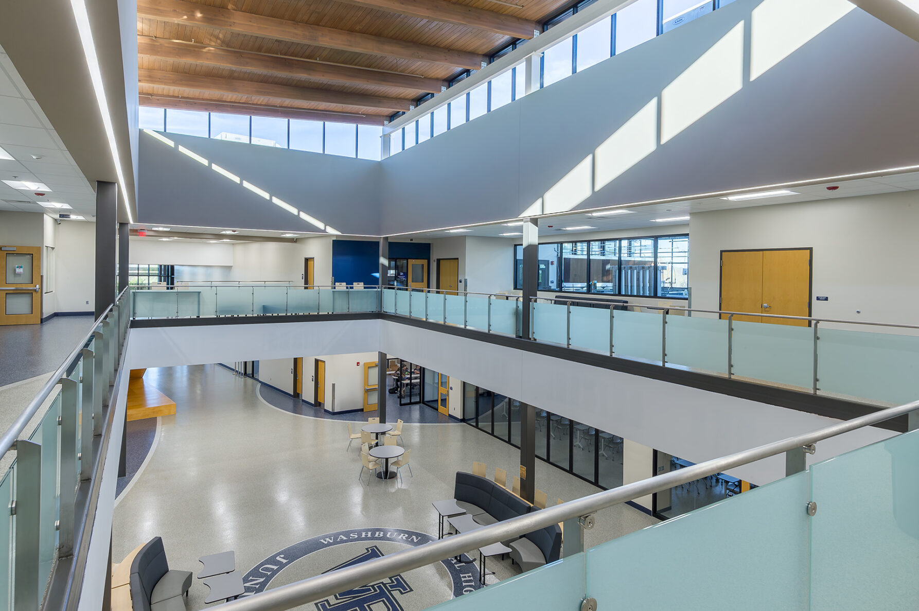 A shot overlooking the upstairs into a commons area at Auburn Washburn High School