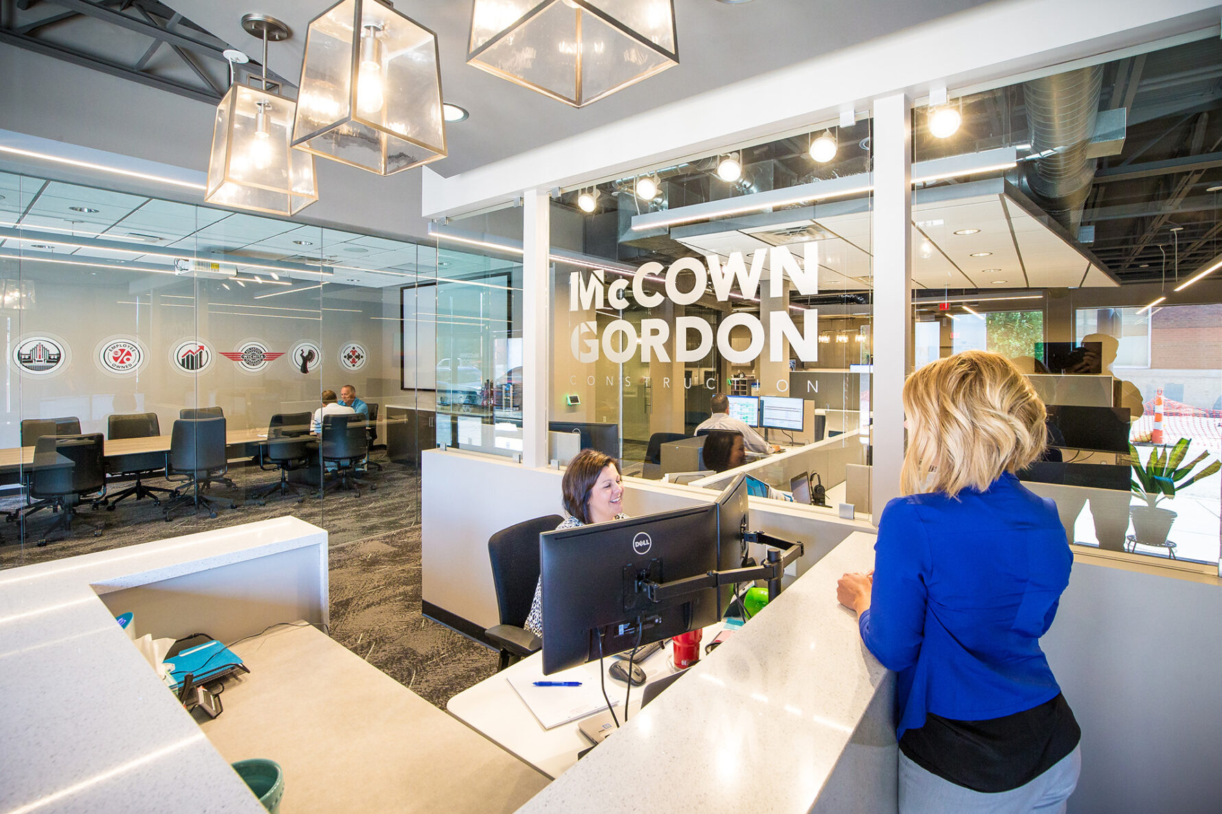 McCownGordon office with two associates talking.