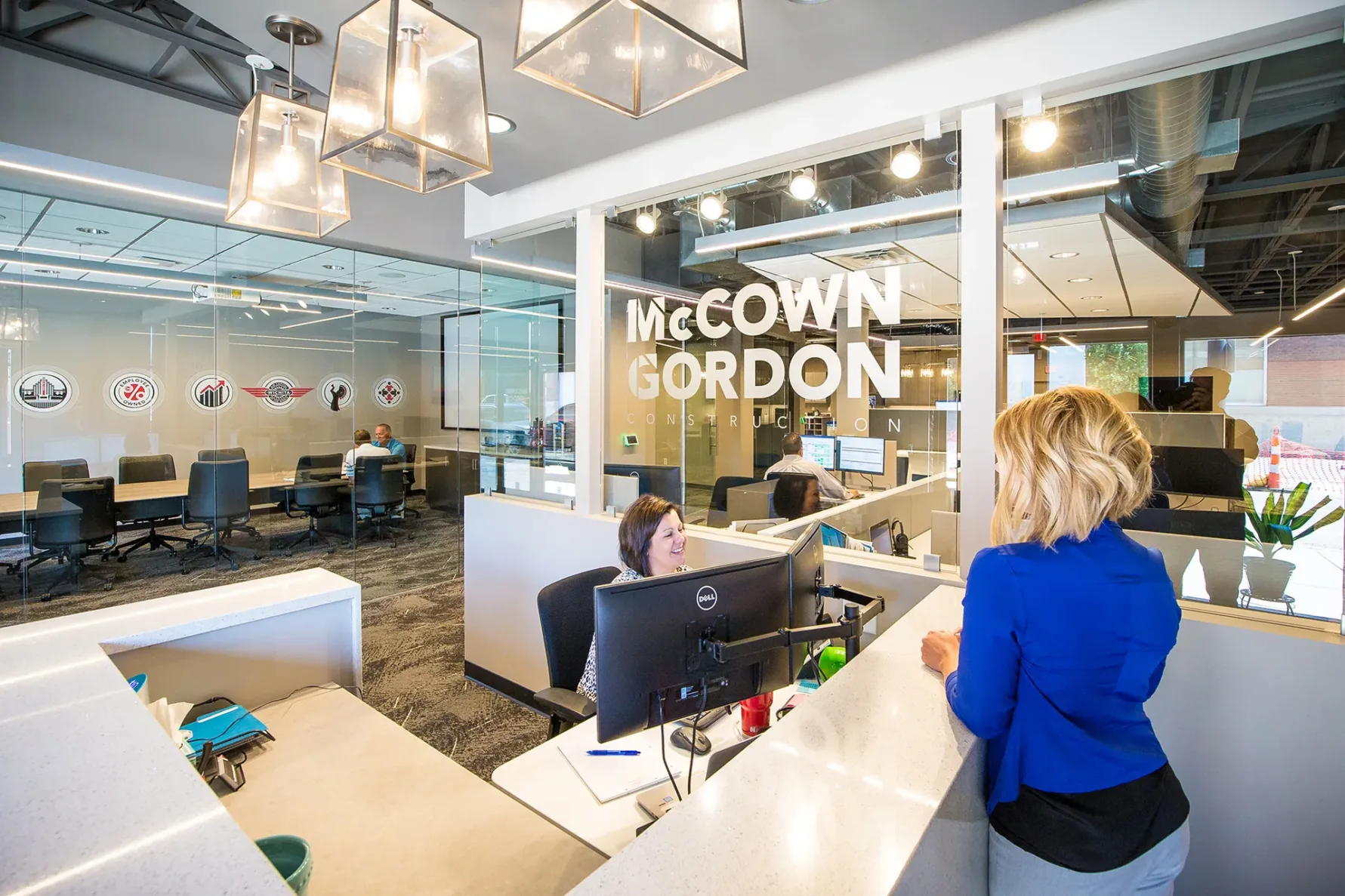 McCownGordon office with two associates talking.