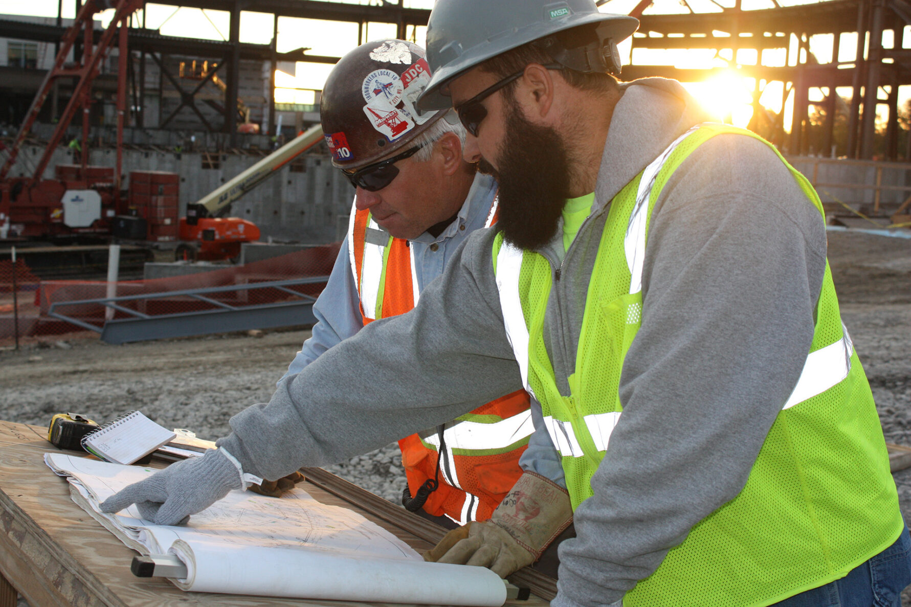 McCownGordon workers look at plans on jobsite.