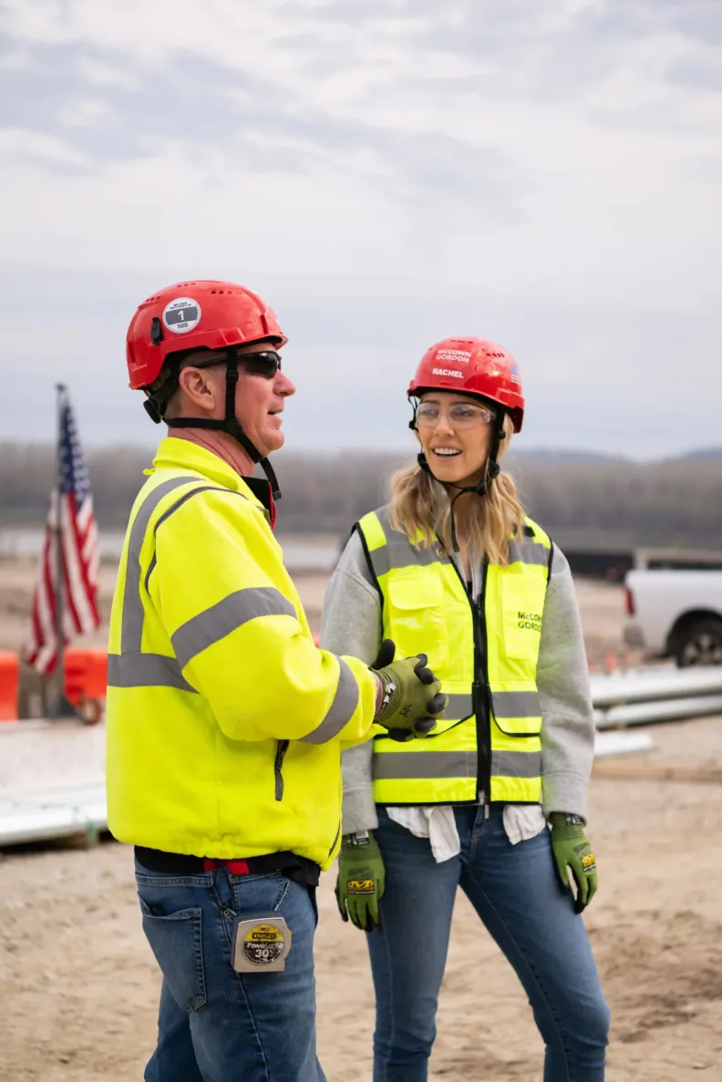 McCownGordon construction workers discuss projects on site.