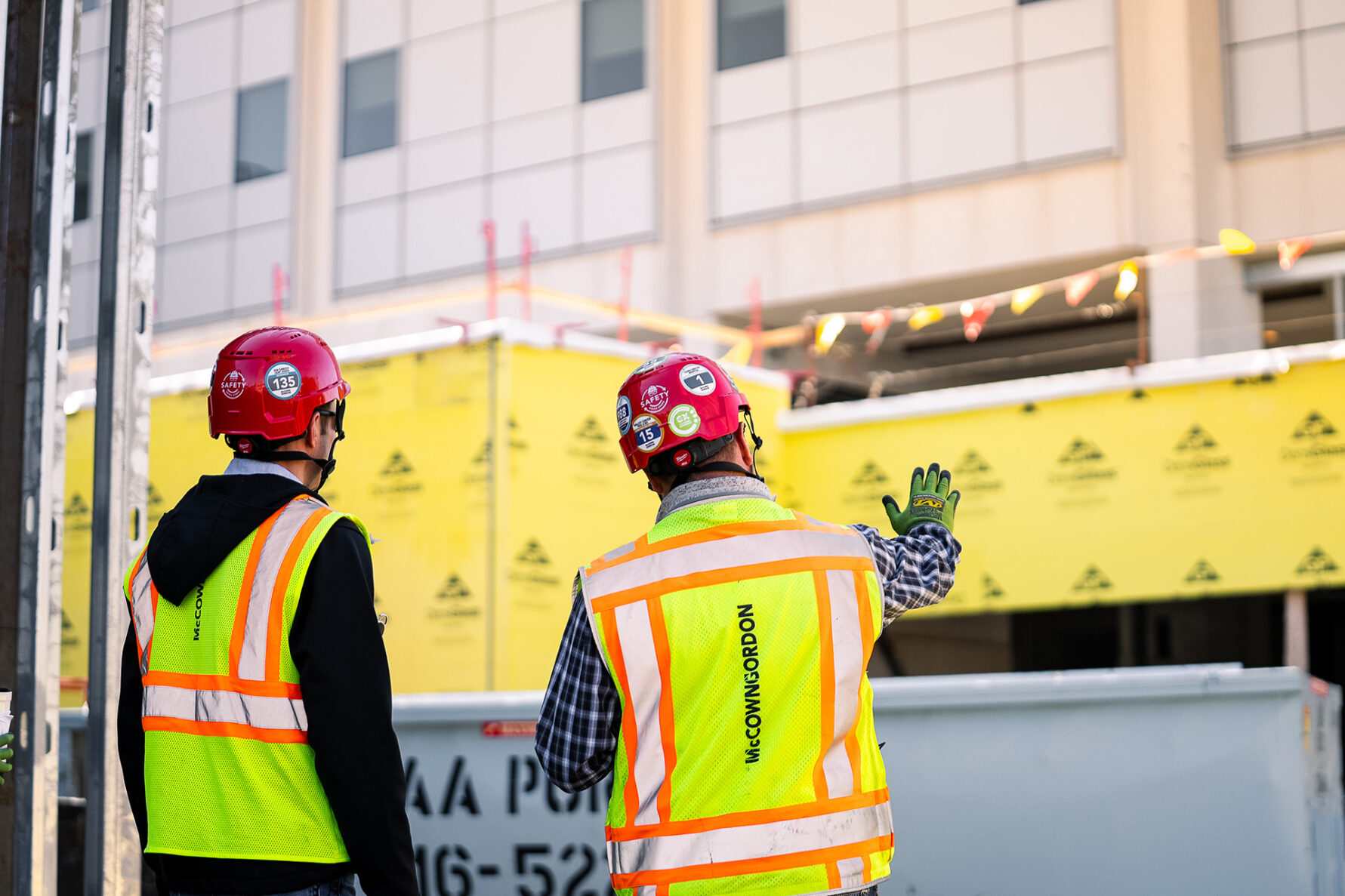Two McCownGordon associates collaborating on construction site.