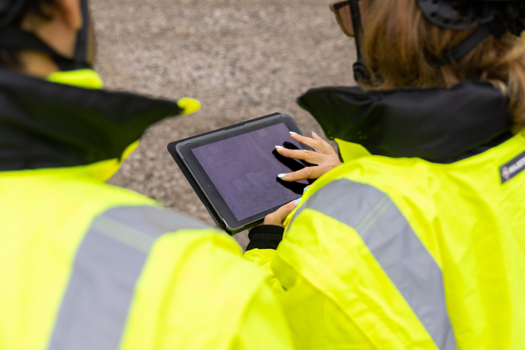 McCownGordon associates working on site using technology.